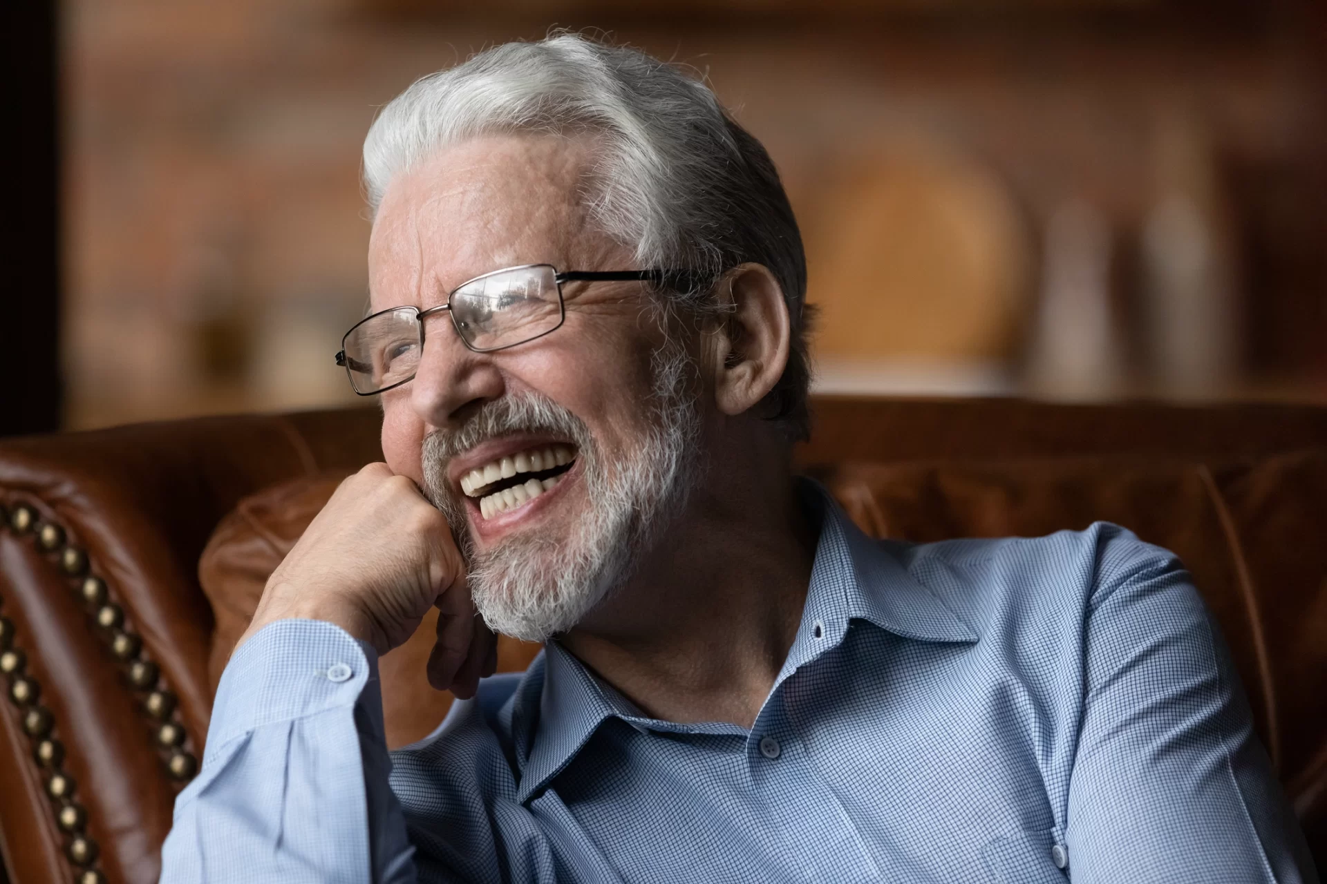 close up of elderly man laughing