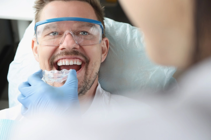 man receiving mouth guard at the dentist
