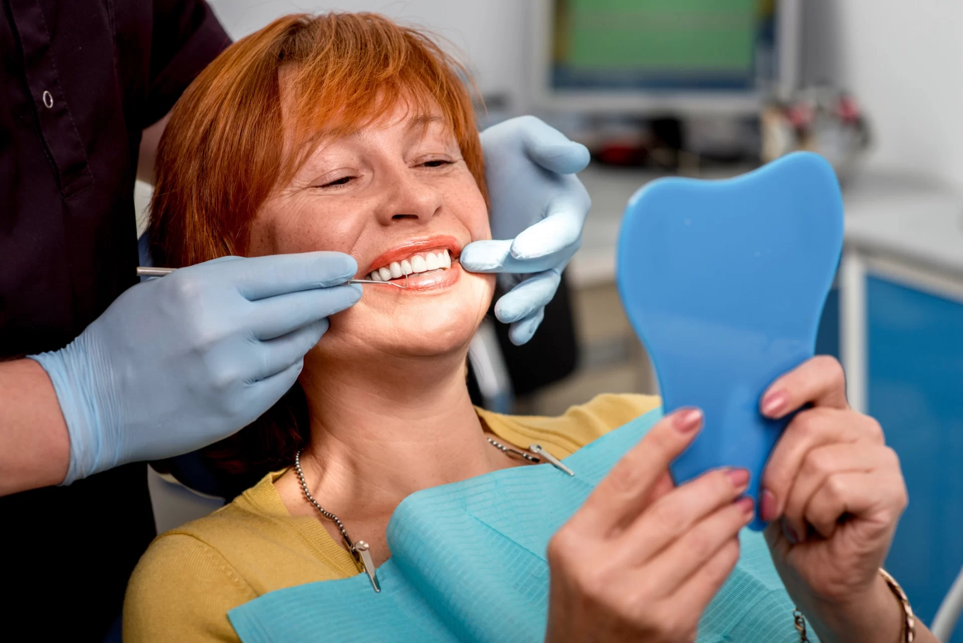 Dentist showing to her beautiful smile